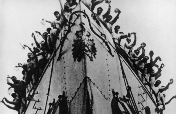 &Ncy;&iecy;&mcy;&ocy;&iecy; &kcy;&icy;&ncy;&ocy; &vcy; &Tcy;&rcy;&icy;&ucy;&mcy;&fcy;&iecy;&colon; &Ecy;&jcy;&zcy;&iecy;&ncy;&shcy;&tcy;&iecy;&jcy;&ncy;&period; &laquo;&Bcy;&rcy;&ocy;&ncy;&iecy;&ncy;&ocy;&scy;&iecy;&tscy; &laquo;&Pcy;&ocy;&tcy;&iecy;&mcy;&kcy;&icy;&ncy;&raquo; &lpar;1925&rpar;